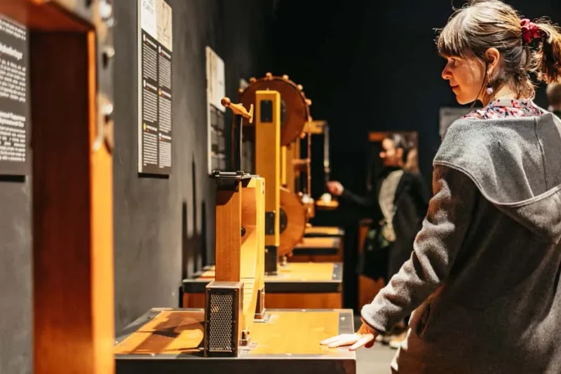 Visitors working a full-size reconstruction of a Leonardo machine, in the family museums in Florence, Italy