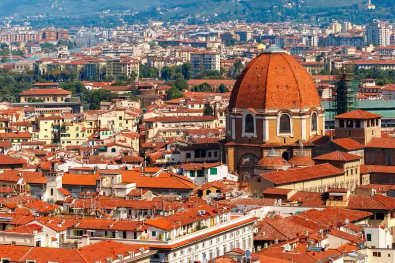 The Medici Chapels and the domes of San Lorenzo above the Florence rooftops, among the essential museums in Florence, Italy